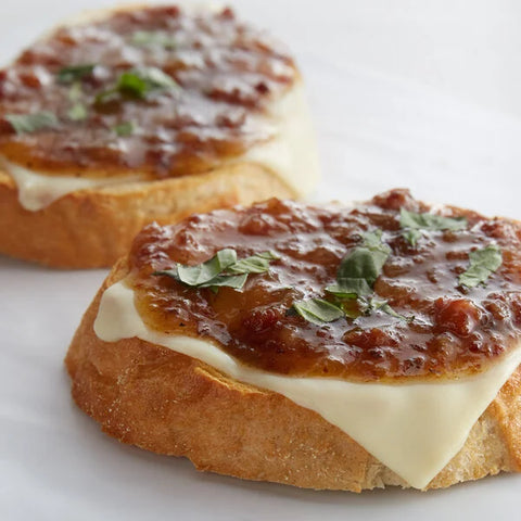 Black Peppercorn Bacon Jam over cheese on sliced bread