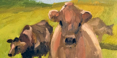 Painting of two cows in a field with a close-up of one cow's face.